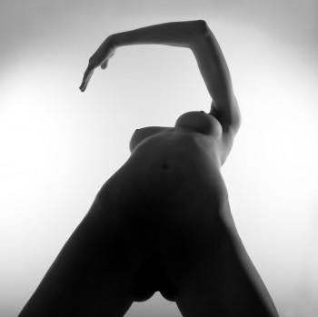 erotic art photo of a naked woman making a motion with her arms