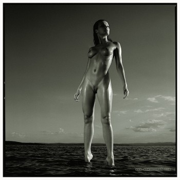 nude girl standing in the water
