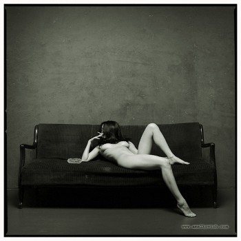 smoking naked woman lying on the couch